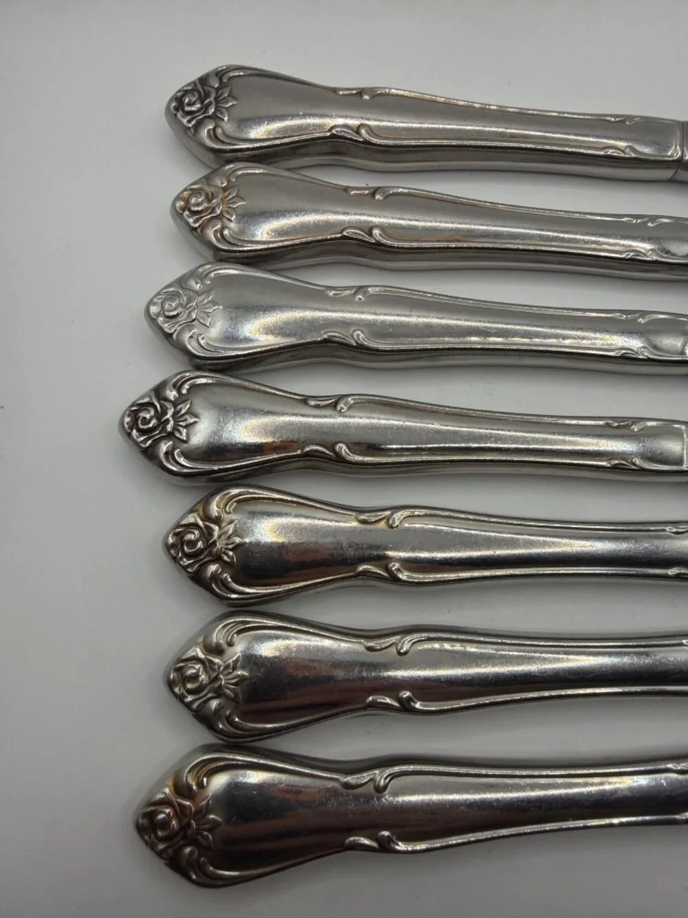 Set Of 8 Vintage Silver-Plated Dinner Knives With Ornate Rose Pattern Handles